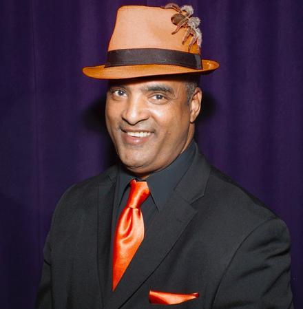 Photo of an African American man with a hat.