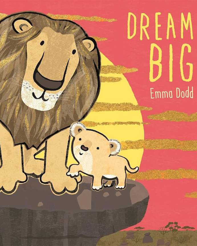 Book cover for Dream Big featuring a cartoon lion and cub on a rock at sunset.
