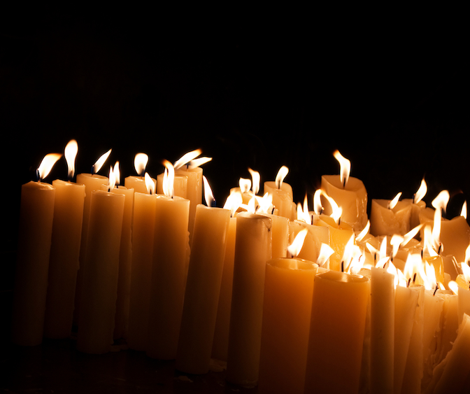 Photo of candles that have been lit.